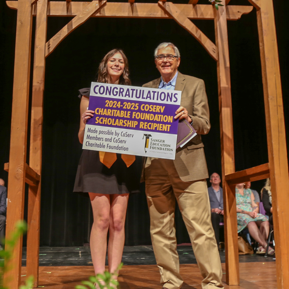Sanger High School Senior Taylor Price received a scholarship from the Sanger Education Foundation, which was funded by the CoServ Charitable Foundation. Presenting the award was Richard Muir, CoServ Electric Board Director for District 1. 