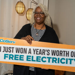 Winner of CoServ's Free Year of Electricity (3,600 value) Cheryl Dixon in her apartment in Frisco, Texas.