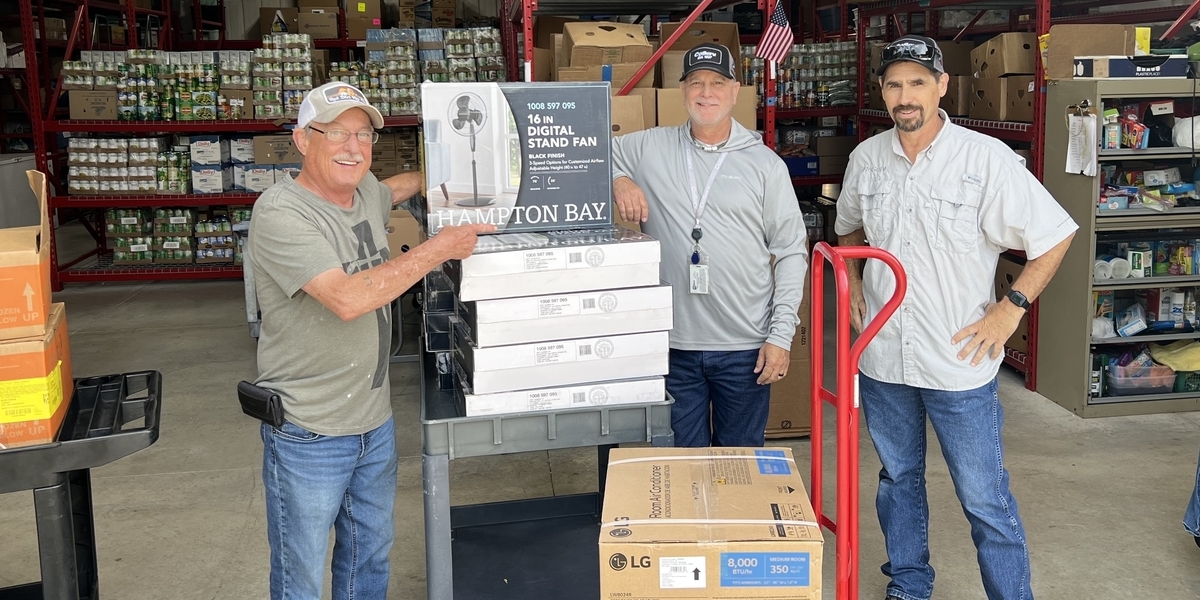 L to R: VISTO team member; Dean Pennington, Energy Solutions Specialist; Jerry Briggs, Energy Solutions Specialist. Photo by JENNIFER EBERT