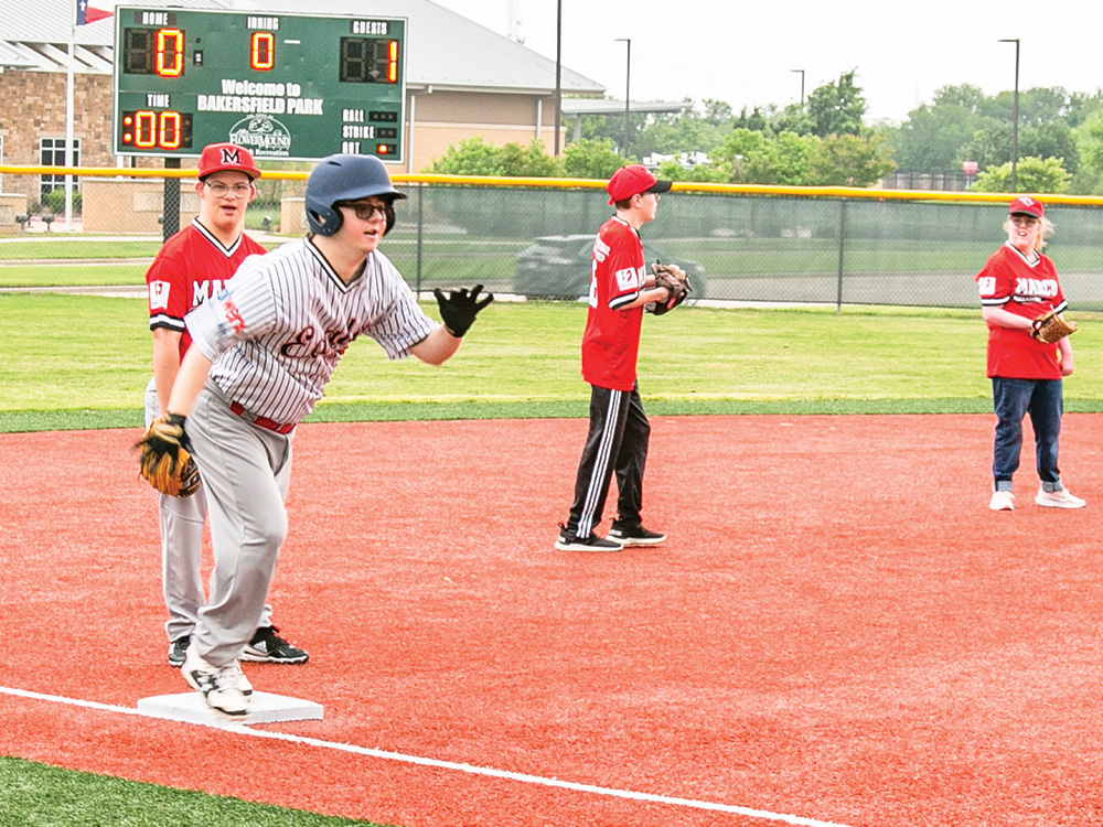 Cameron Lanford gets ready to score from third base.