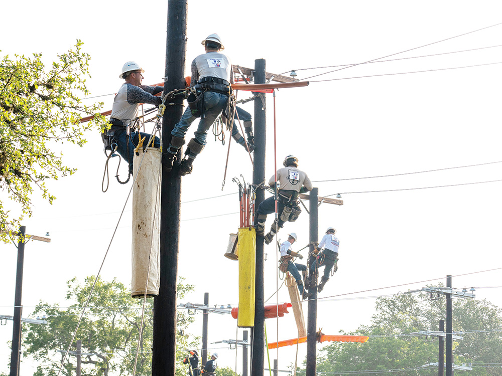 Lineman compete during the 2024 TLRA Lineman Rodeo in Seguin, Texas.