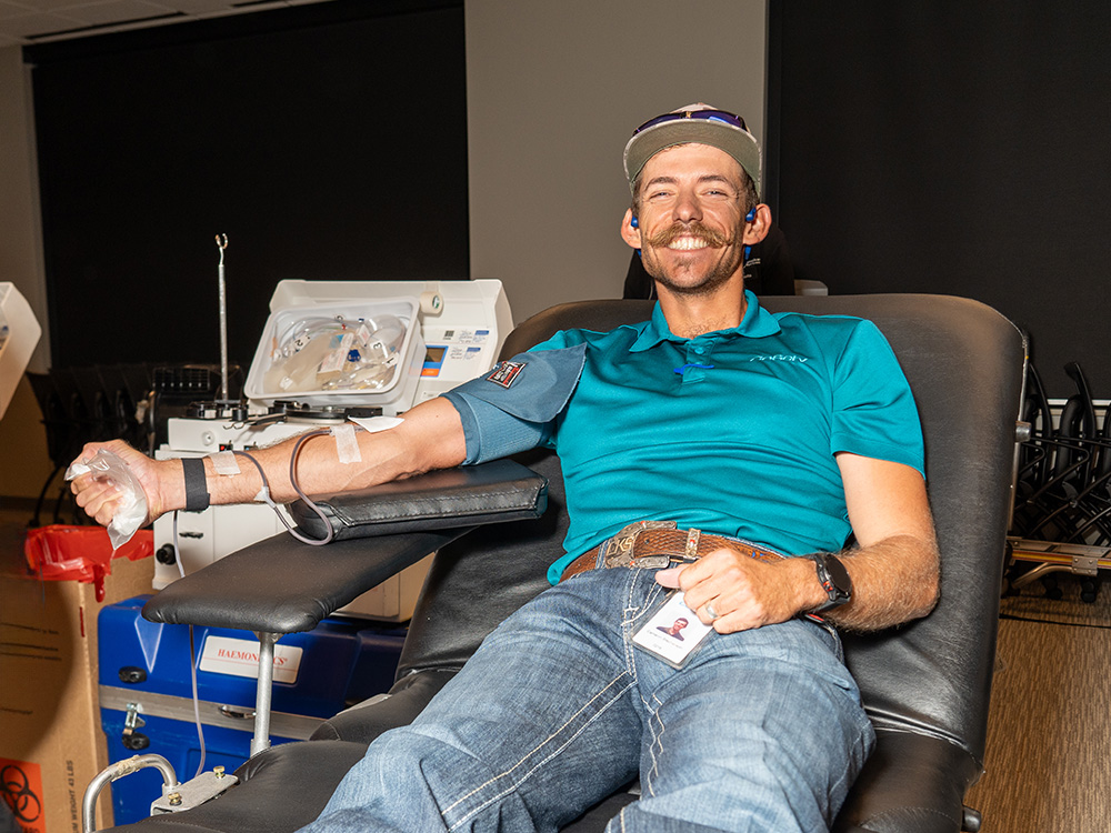 CoServ employees and the public were invited to give blood at the fall CoServ-sponsored Red Cross blood drive at CoServ headquarters in Corinth. Safety Specialist Cameron Stephens donates blood.