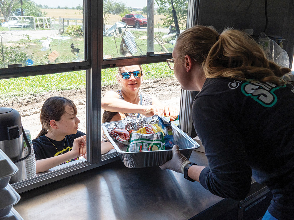 CoServ Employee’s provided food and water to victims, volunteers and first responders after the Memorial Day weekend tornado in Valley View. Photo by BRIAN ELLEDGE