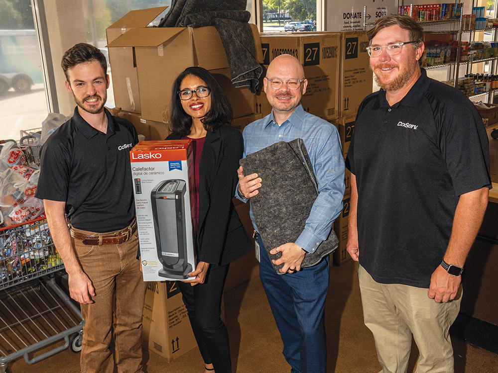 (L to R) Walker Sims – CoServ, Laryssa Ingham and Tripp Jackson – FFS, and David Lay – CoServ, receives vital donations from CoServ.